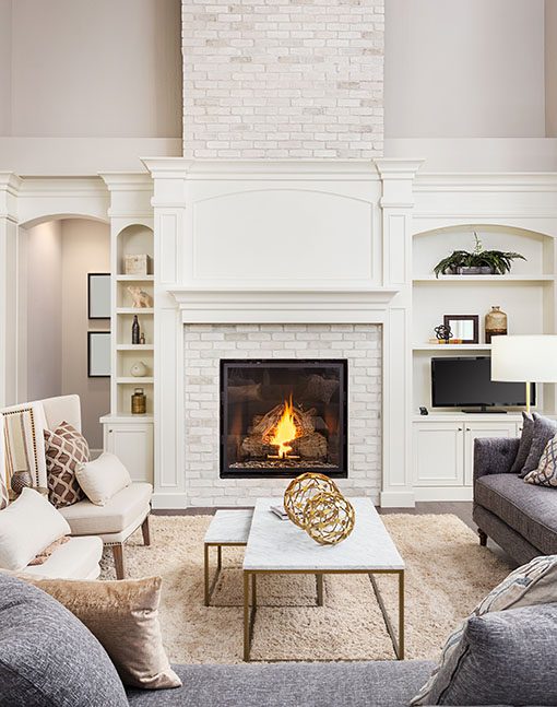 A white living room with a fireplace
